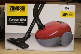 A new Zanussi Compact Go ll Red, 750W, 1.5L, 5M automatic cord rewind vacuum cleaner.