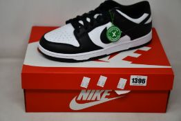 A pair of as new Nike Dunk Low Retro with authentication tag (UK 9.5).