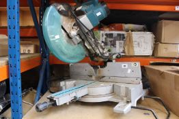 A pre-owned Makita DXT mitre saw.