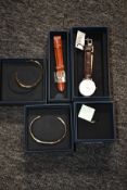 An as new Daniel Wellington watch, additional strap, two bangles and a ring.