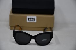 A pair of as new Burberry sunglasses.