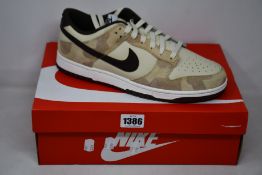 A pair of as new Nike Dunk Low Retro PRM (UK 10).