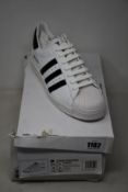 A pair of as new Prada Adidas Superstar sneakers (UK 9 - Damaged box).