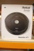 A boxed as new iRobot Roomba 671 vacuuming robot.