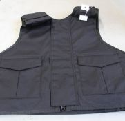 A Safe Guard Armour Patrol 1 tactical armour vest in Black, with a detachable 'Public Safety' Velcro