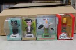 A large quantity of Puckator Solar Powered novelty bobble heads to include Mr.Bean, Donald Trump,
