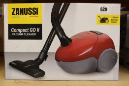 A new Zanussi Compact Go ll Red, 750W, 1.5L, 5M automatic cord rewind vacuum cleaner.