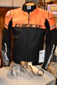 An as new Dainese Agile leather biking jacket in black/orange (Size 52 - RRP £315).