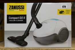 A new Zanussi Compact Go ll White, 750W, 1.5L, 5M automatic cord rewind vacuum cleaner.