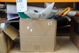 A box of miscellaneous items to include books, toys, light up star and water bottles.