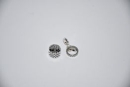 Two Pandora Logo Circles Dangle charms (RRP £45) and three Pandora Openwork Family Root charms (