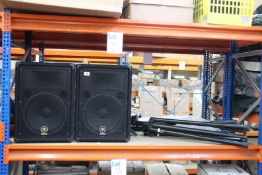 A pair of Yamaha BR12 speakers with a pair of speaker stands.