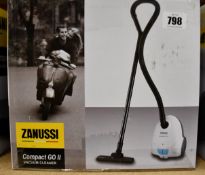 A new Zanussi Compact Go ll White, 750W, 1.5L, 5M automatic cord rewind vacuum cleaner.