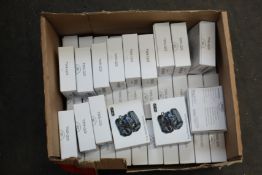 Forty five TWS-Q25 wireless headphones in charging cases.