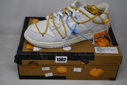 A pair of as new Nike Dunk Low Off White Lot 34 (UK 11).