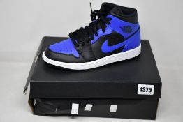 A pair of as new Nike Air Jordan 1 Mid (UK 6).