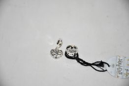 A Pandora Harry Potter Hogwarts School charm (RRP £37) and three Pandora Heart Family Tree Dangle