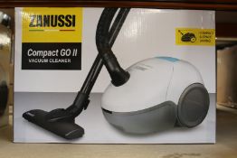 A new Zanussi Compact Go ll White, 750W, 1.5L, 5M automatic cord rewind vacuum cleaner.