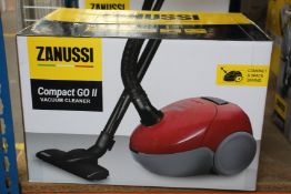 A new Zanussi Compact Go ll Red, 750W, 1.5L, 5M automatic cord rewind vacuum cleaner.