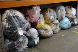 Thirteen bags of pre-owned clothing and related items.