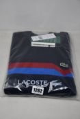 An as new Lacoste sweater (FR 3/US S - RRP £200).