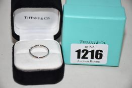 A Tiffany & Co Platinum Nesting Narrow Band ring (Size L - RRP £980).