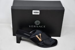 A pair of as new Versace sandals in black (IT 38 - RRP £560).