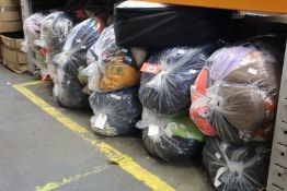 Twelve bags of pre-owned clothing and related items.