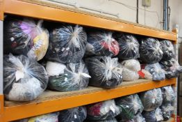 Twelve bags of pre-owned clothing and related items.