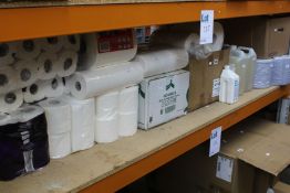 A quantity of assorted cleaning products, hand towels and toilet rolls.