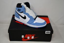 A pair of as new Nike Air Jordan 1 Retro High (UK 9).