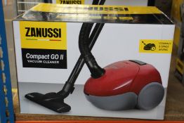 A new Zanussi Compact Go ll Red, 750W, 1.5L, 5M automatic cord rewind vacuum cleaner.