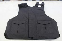 A Safe Guard Armour Patrol 1 tactical armour vest in Black, with a detachable 'Public Safety' Velcro