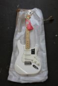A Fender Player Stratocaster MN guitar in polar white.