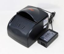 A pre-owned 3M AT9000 Passport/Full page ID Document Scanner (Power supply included).