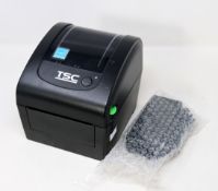 A pre-owned TSC DA200 Desktop Direct Thermal Barcode Printer (Power supply included) (Tested,