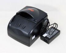 A pre-owned 3M AT9000 Passport/Full page ID Document Scanner (Power supply included).