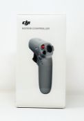 A boxed as new DJI FPV Drone Motion Controller (Box sealed).