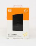 A boxed as new WD My Passport 2TB in Black (Box sealed).