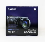A boxed as new Canon PowerShot SX730 HS 20.3MP Digital Camera (2-pin plug included).