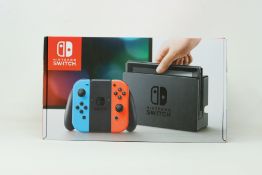A boxed as new Nintendo Switch Console in Neon Red/Blue (M/N: HAD-S-KABAA-JPN) (Some packaging