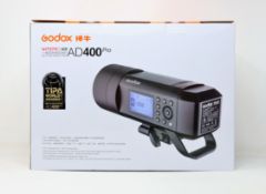 A boxed as new Godox Wistro AD400 Pro All-in-One Outdoor Flash (Two pin plug).