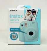 A boxed as new Fujifilm Instax Mini 9 Instant Camera in Blue.