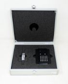 A pre-owned Tecan Multicheck Plus II QC Plate for Tecan Infinite Microplate Readers (USB stick