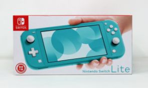 A boxed as new Nintendo Switch Lite Console in Turquoise (M/N: HDH-S-BAZAA-HKG) (Some packaging text