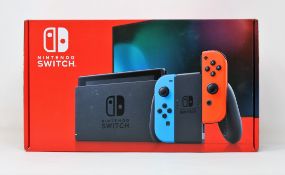 A boxed as new Nintendo Switch Console in Neon Red/Blue (M/N: HAD-S-KABAA-JPN) (Some packaging
