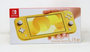 A boxed as new Nintendo Switch Lite Console in Yellow (M/N: HDH-S-YAZAA-JPN) (Some packaging text in