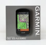 A boxed as new Garmin Edge 1030 Plus GPS Bike Computer Bundle (Box sealed).