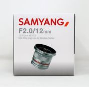 A boxed as new Samyang 12mm F2.0 NCS CS Ultra-Wide Angle Lens for Fuji X Mirrorless Cameras in