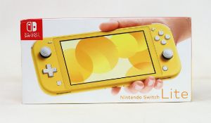 A boxed as new Nintendo Switch Lite Console in Yellow (M/N: HDH-S-YAZAA-JPN) (Some packaging text in